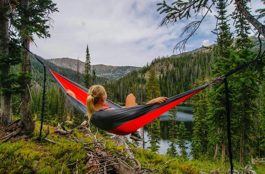 woman on hammock near to river