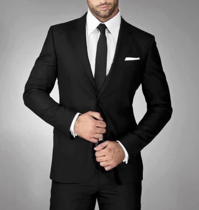 Black suit with a white shirt and black tie