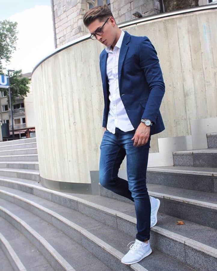 Blue blazer with a white shirt and also the blue jeans