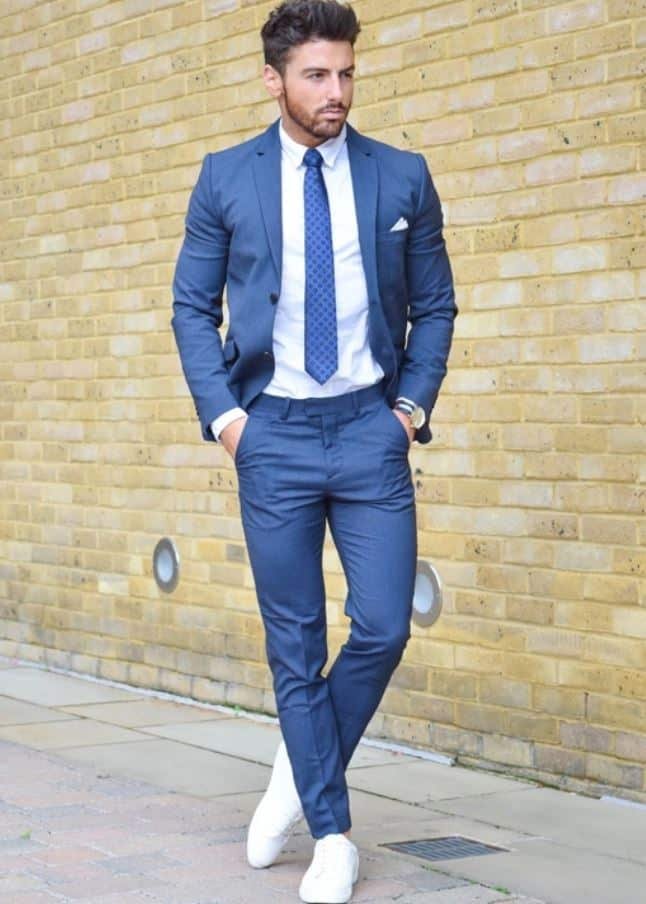 Blue suit with a white shirt and blue tie