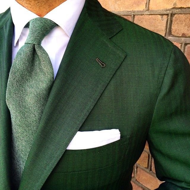 Green suit with a white shirt and green tie