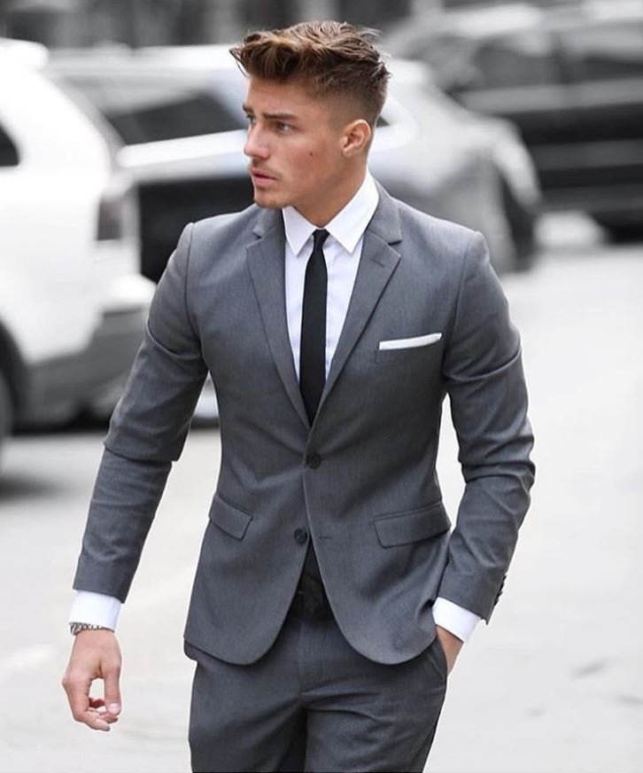 Grey suit with a white shirt and black tie
