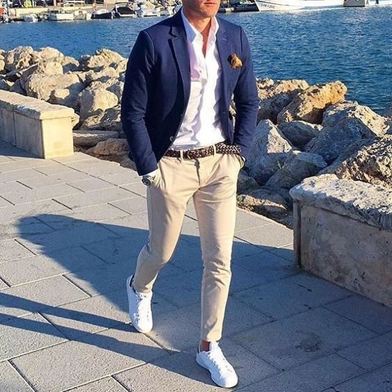 Navy suit with navy trousers and a white shirt with white sneakers