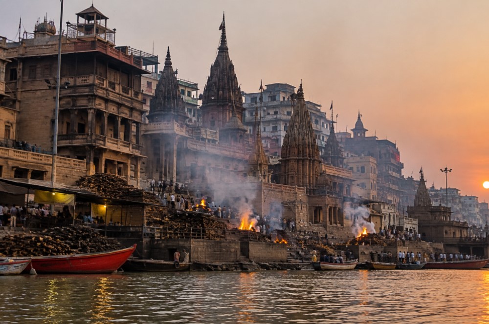 Respectful distant photograph showing the architecture and atmosphere of the ghat